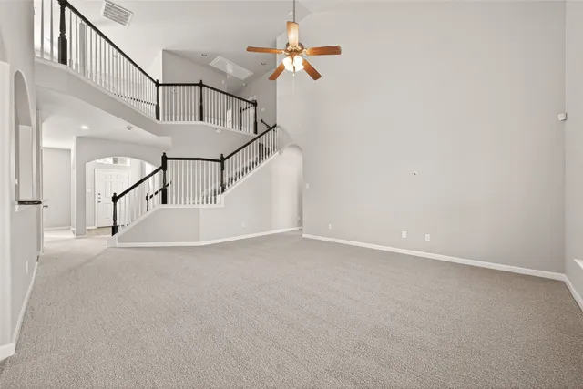 a view of a livingroom with wooden floor and white walls