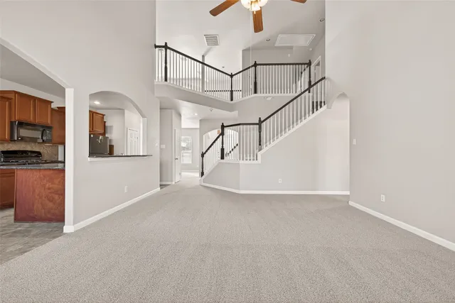a view of a livingroom with a ceiling fan