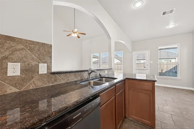 a kitchen with a stove and a microwave
