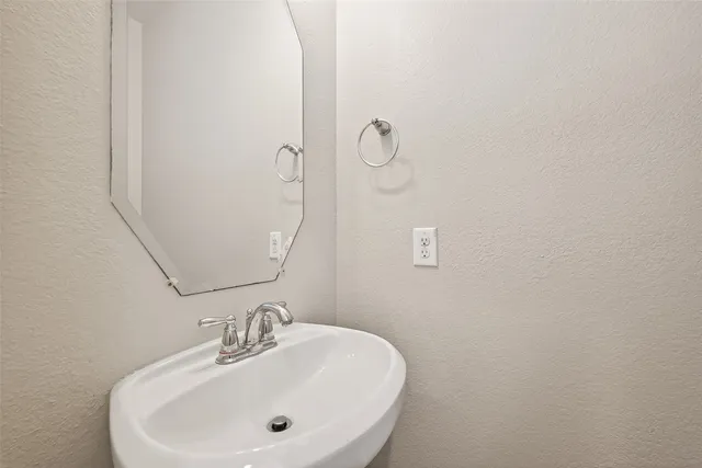 a white bath tub sitting next to a shower