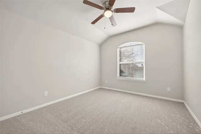 a view of yard with swimming pool and wooden fence