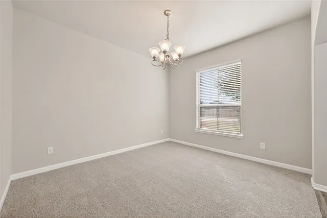 a view of staircase with lots of frames and a rug