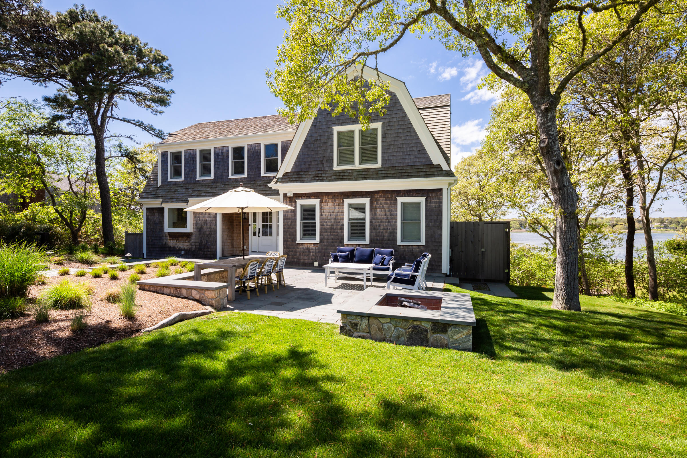 60 Tappan Drive Chatham, MA 02633 - Photo 5 of 46 a front view of a house with swimming pool garden and patio