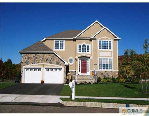 26 Carnation Road Monroe Township, NJ 08831 - Photo 1 of 10 a front view of a house with a yard and garage