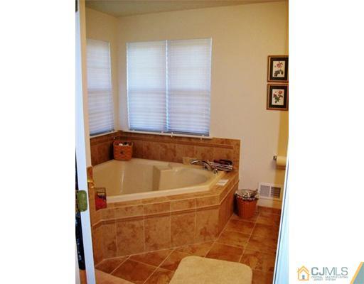 26 Carnation Road Monroe Township, NJ 08831 - Photo 5 of 10 a bathroom with a bathtub and shower