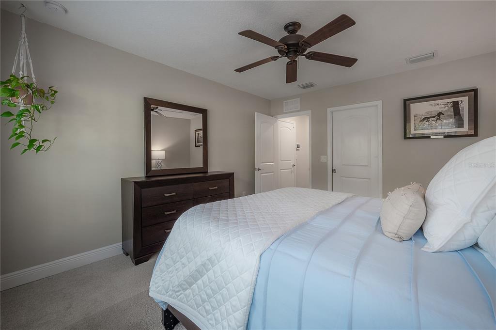 3108 West Villa Rosa Street Tampa, FL 33611 - Photo 36 of 58 a bedroom with a large bed and a tv