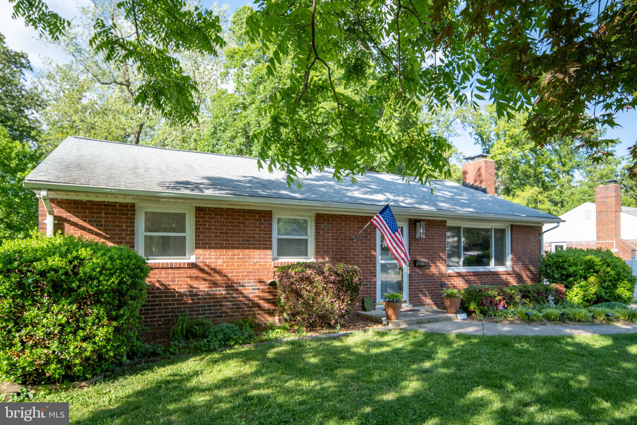 6714 Ruskin Street Springfield, VA 22150 - Photo 5 of 63 a view of a house with a yard plants and large tree