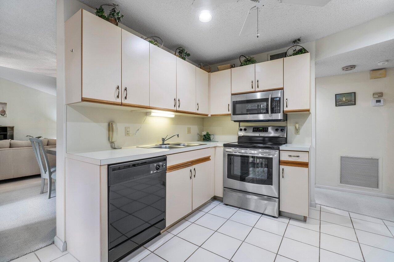 5650 Coach House Circle, Unit D Boca Raton, FL 33486 - Photo 13 of 32 PLENTY OF CABINET SPACE