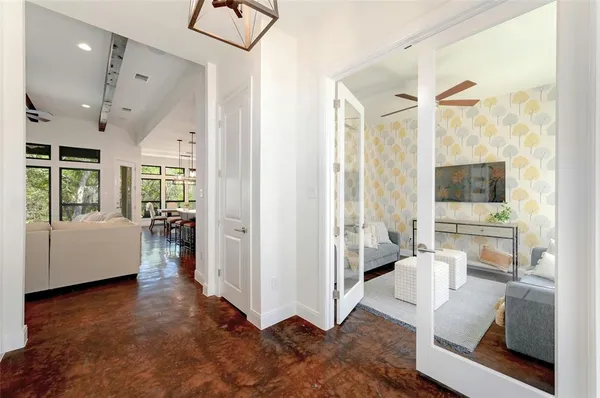 a living room with furniture and a large window