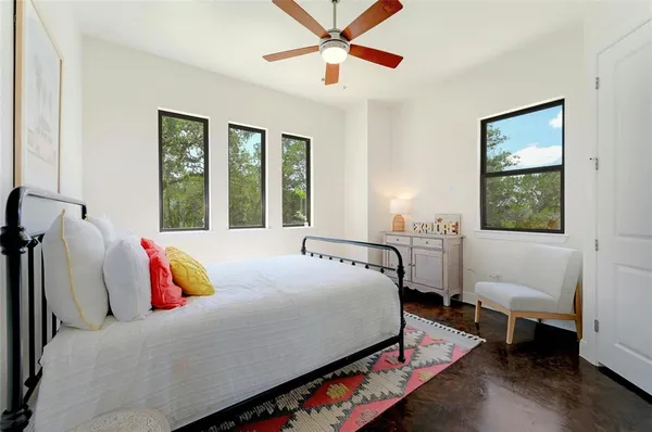 a bedroom with a bed and a couch