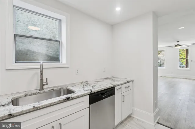 a workspace with furniture and a potted plant