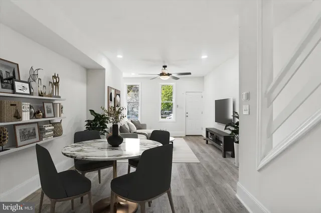 a view of a dining room with furniture and wooden floor