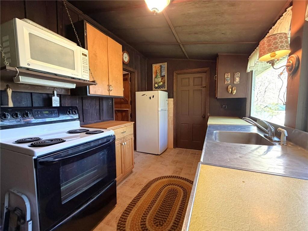 219 Noel Road Latrobe, PA 15650 - Photo 12 of 27 a kitchen that has a stove and a microwave