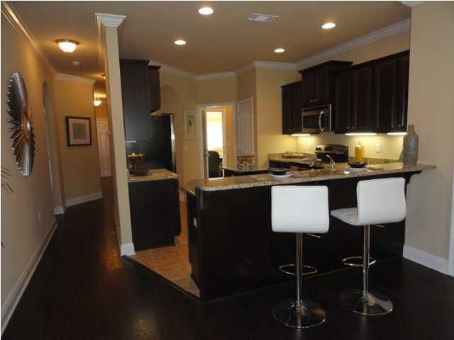 Lot 277 Riverbirch Loop Santa Rosa Beach, FL 32459 - Photo 3 of 8 a kitchen with granite countertop a sink appliances and cabinets