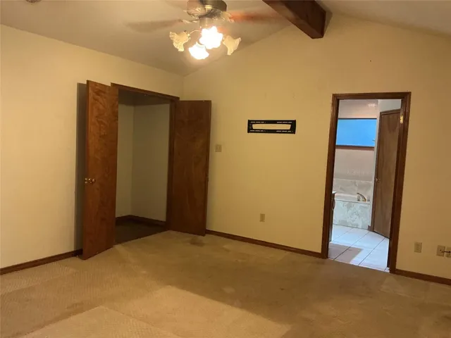 a view of a hallway with closet area