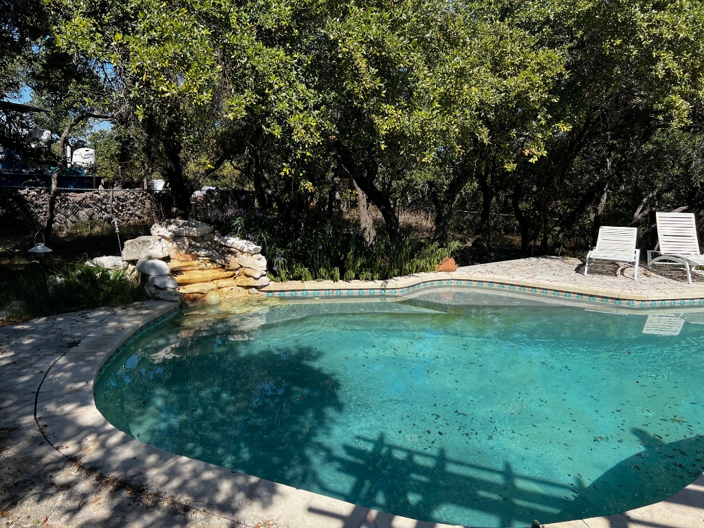 319 Fawnridge Street Georgetown, TX 78628 - Photo 19 of 24 a view of swimming pool with a yard