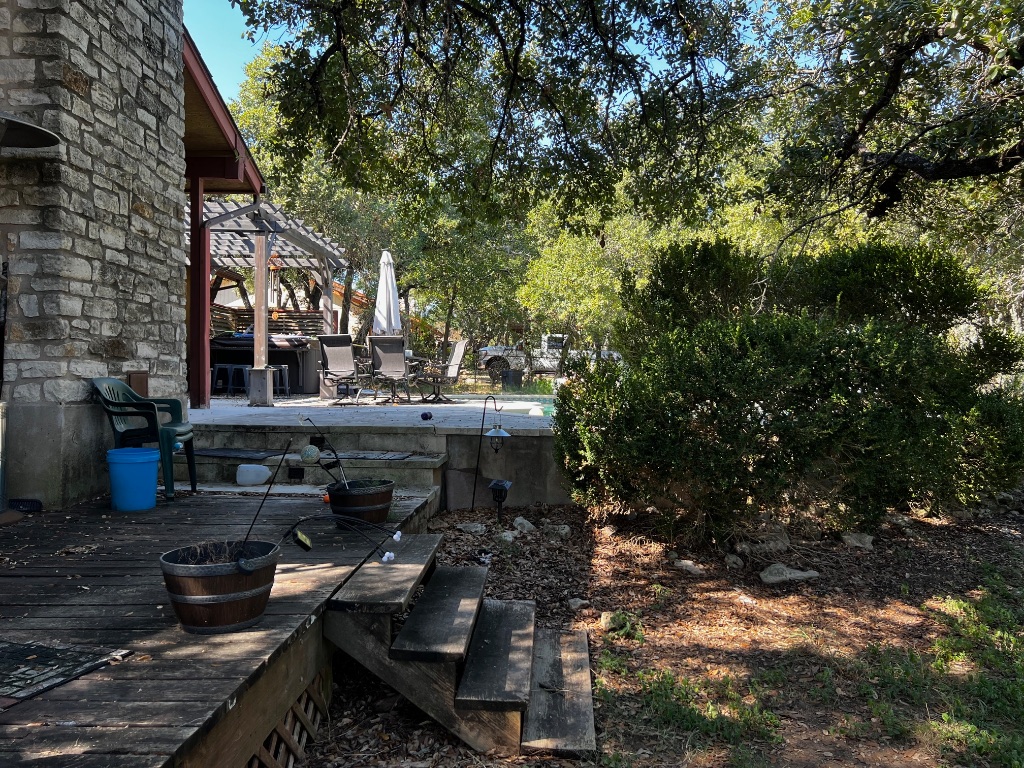 319 Fawnridge Street Georgetown, TX 78628 - Photo 23 of 24 a view of a house with backyard water fountain and sitting area
