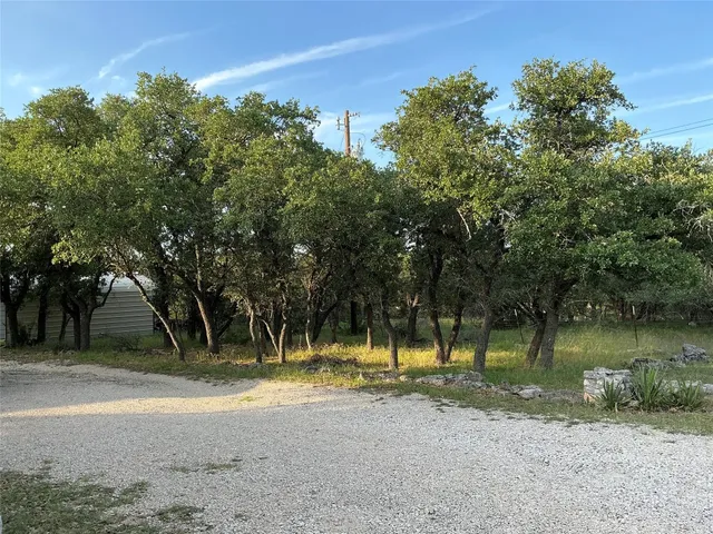 a view of a yard with an outdoor space
