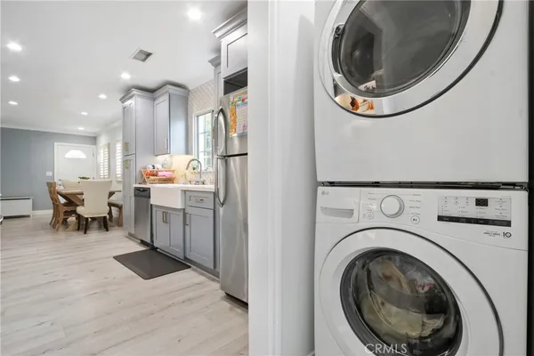 a view of a kitchen with a washer and dryer