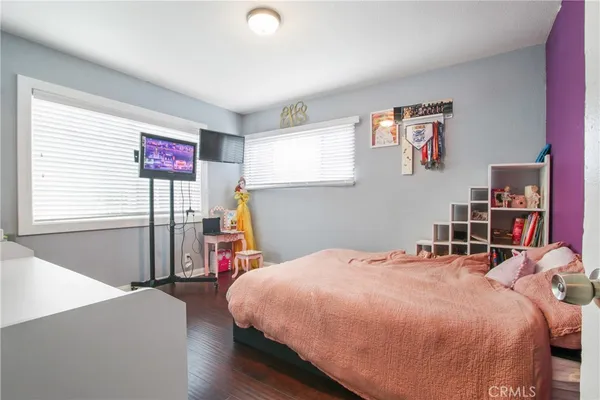 a bed room with a bed and a desk