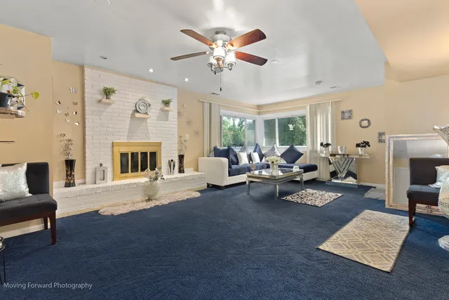 a living room with furniture and a fireplace