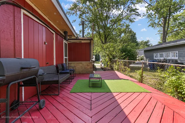 a view of swimming pool with a lounge chairs