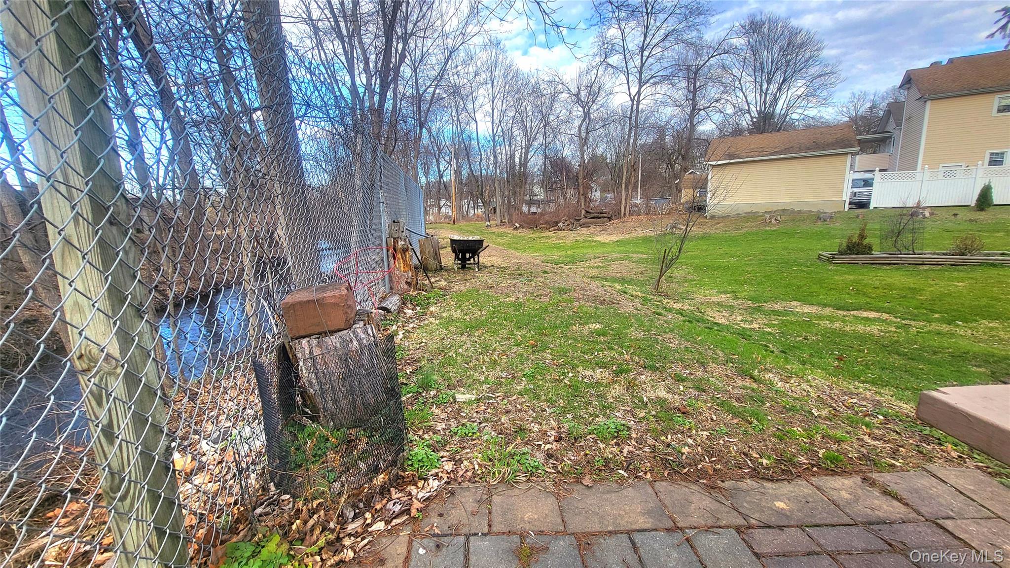 1 Lawrence Road Poughkeepsie, NY 12601 - Photo 31 of 36 a backyard of a house with table and chairs