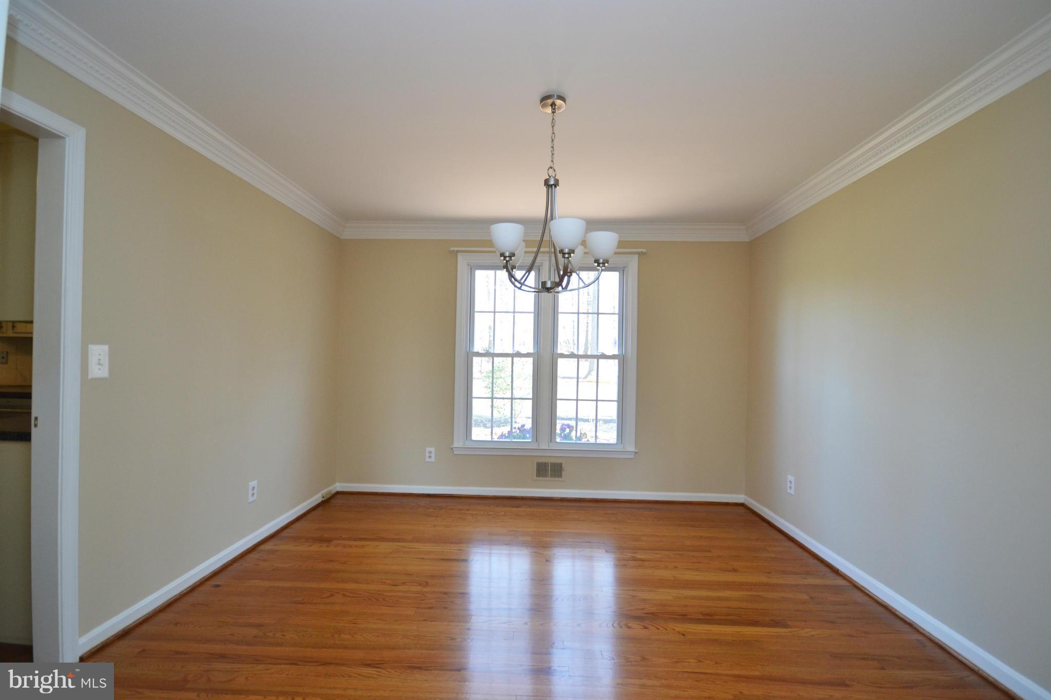 12909 Gent Road Reisterstown, MD 21136 - Photo 5 of 29 Dining Room with crown molding and chair railing.