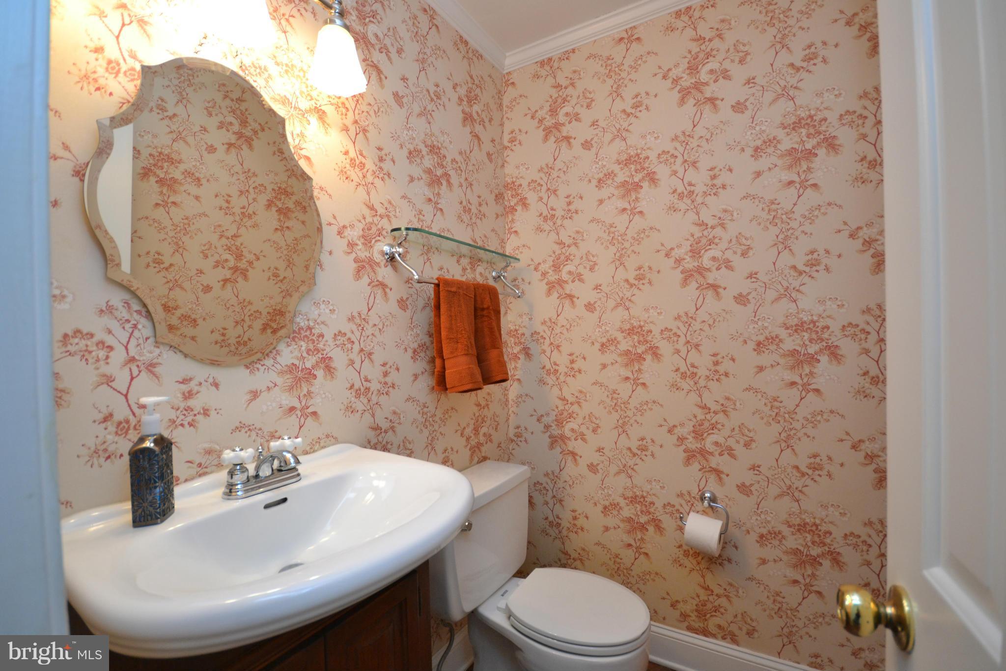 12909 Gent Road Reisterstown, MD 21136 - Photo 8 of 29 Main level powder room with vanity sink.