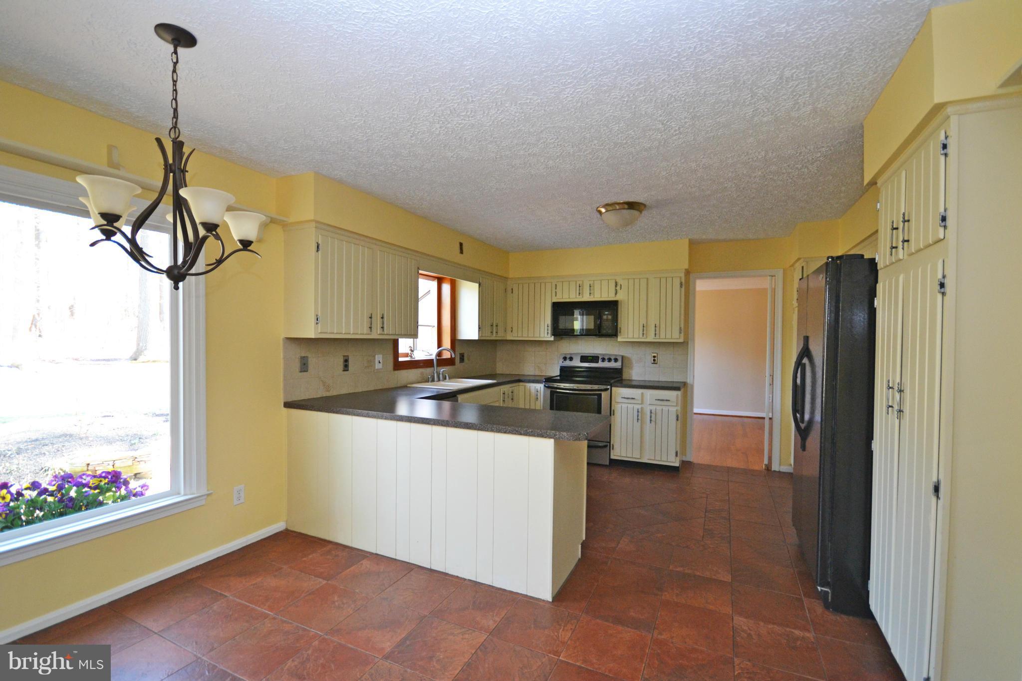 12909 Gent Road Reisterstown, MD 21136 - Photo 10 of 29 Kitchen with large window overlooking patio.