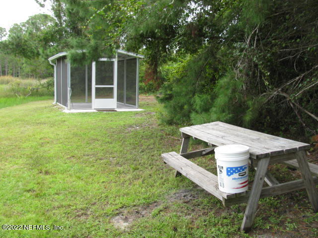 261 Byrd Road Crescent City, FL 32112 - Photo 7 of 35 SCREEN ROOM & TABLE IMG_0040
