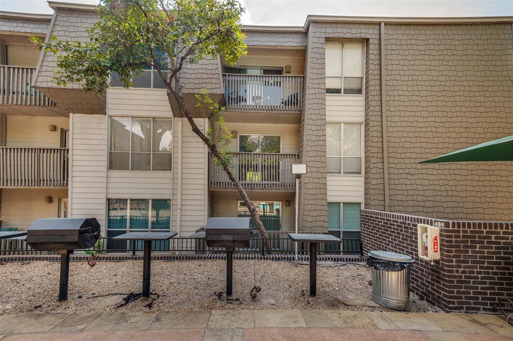 4859 Cedar Springs Road, Unit 254 Dallas, TX 75219 - Photo 10 of 14 a view of a brick house with chairs