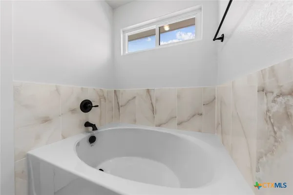 a bathroom with a sink and a tub