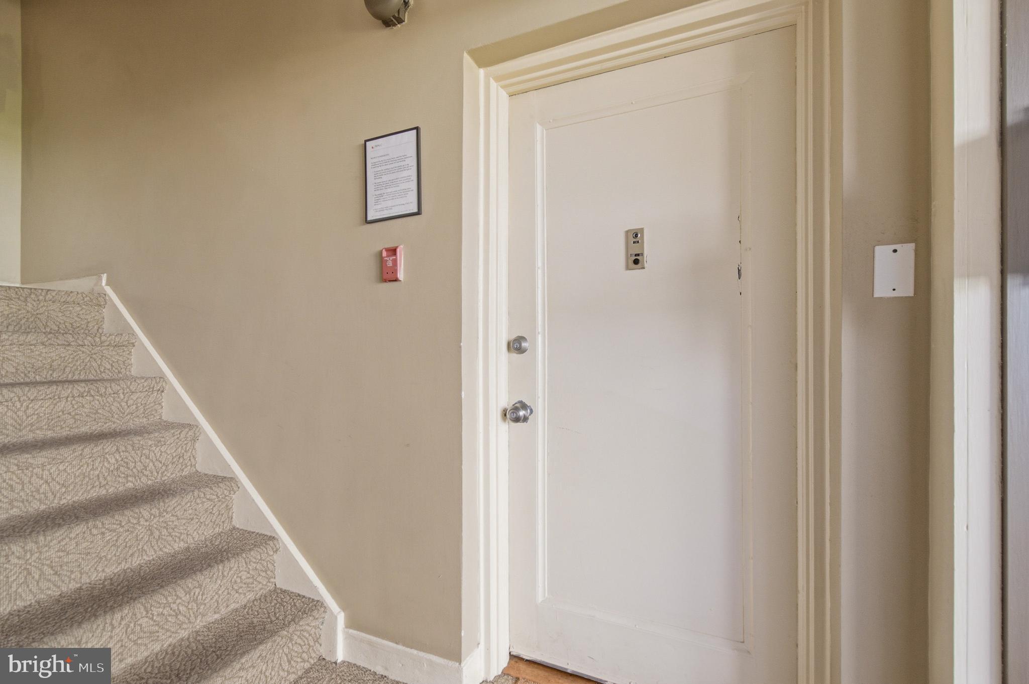 2606 Tunlaw Road Northwest, Unit 2 Washington, DC 20007 - Photo 2 of 14 a view of staircase with white walls