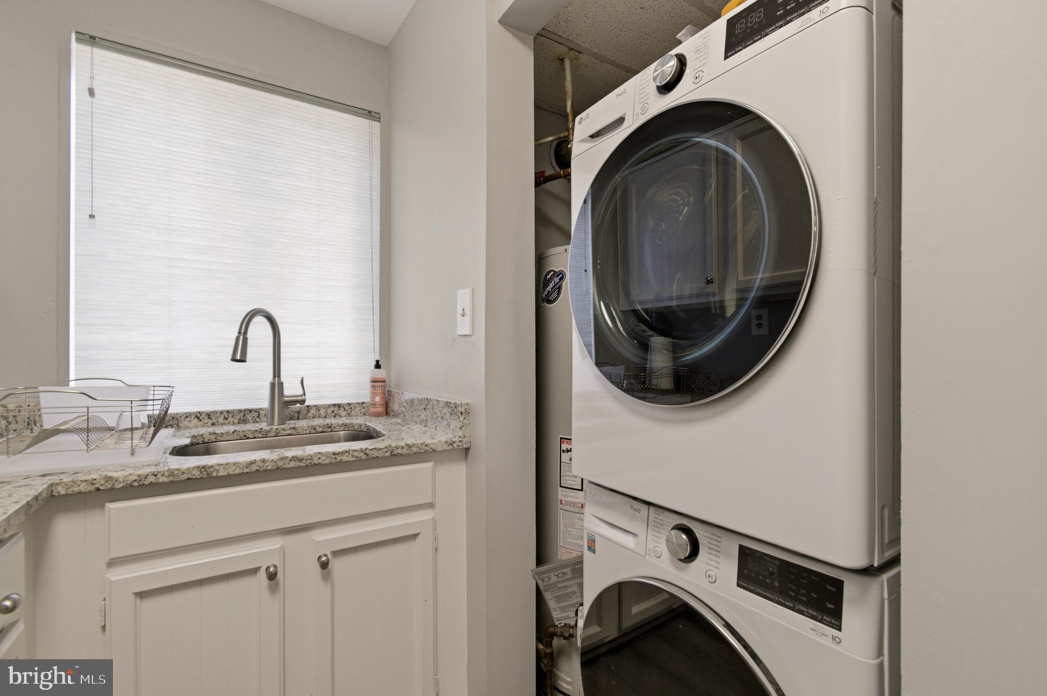 2606 Tunlaw Road Northwest, Unit 2 Washington, DC 20007 - Photo 9 of 14 a utility room with dryer and washer
