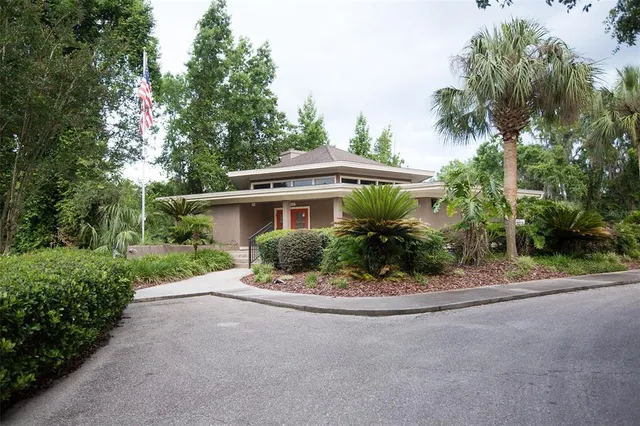 a front view of a house with a yard and a garage