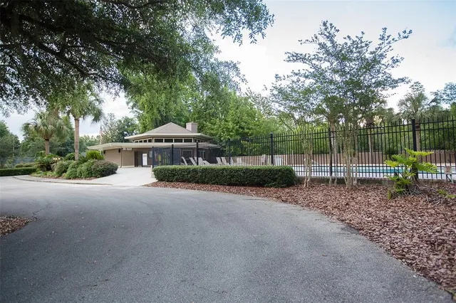a view of a house with a backyard and a slide
