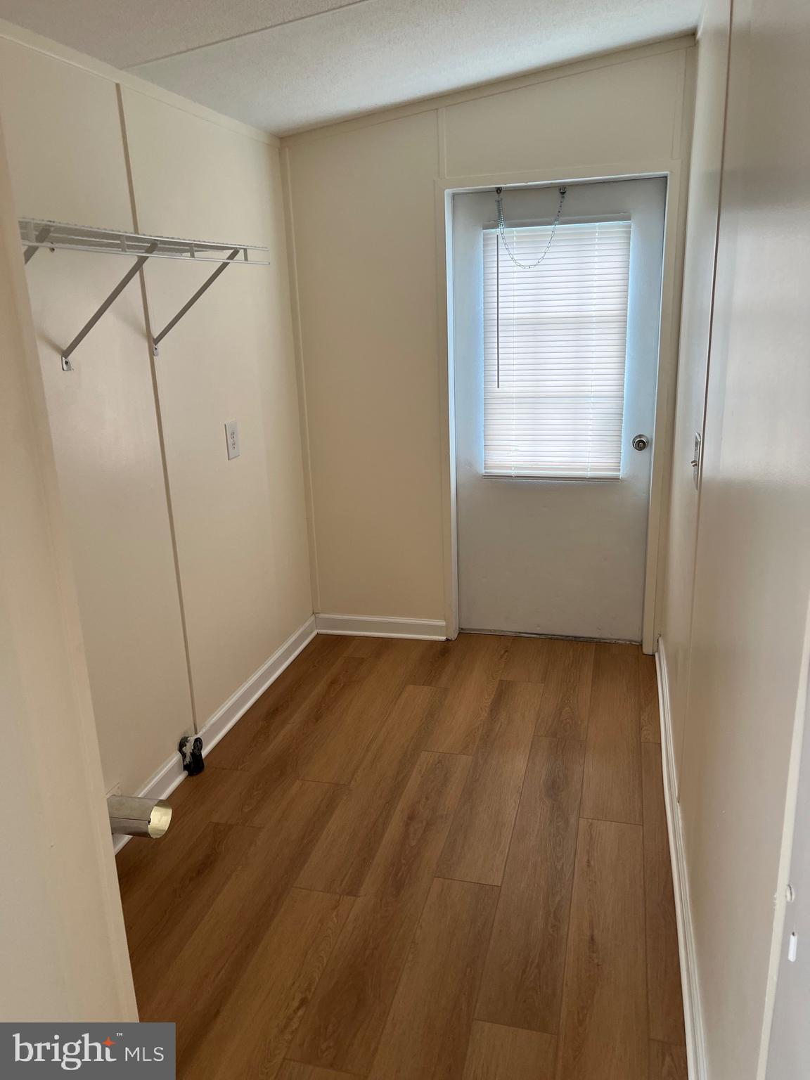 65 Dugan Court Hedgesville, WV 25427 - Photo 6 of 14 a view of a room with wooden floor and windows