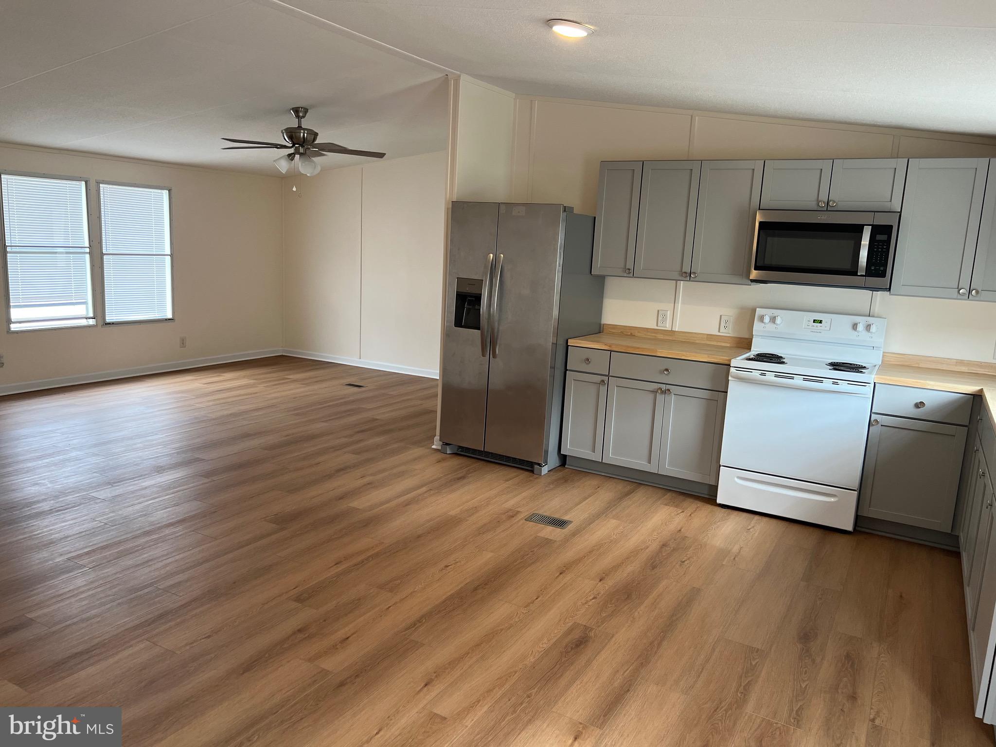 65 Dugan Court Hedgesville, WV 25427 - Photo 7 of 14 a kitchen with a refrigerator sink and microwave