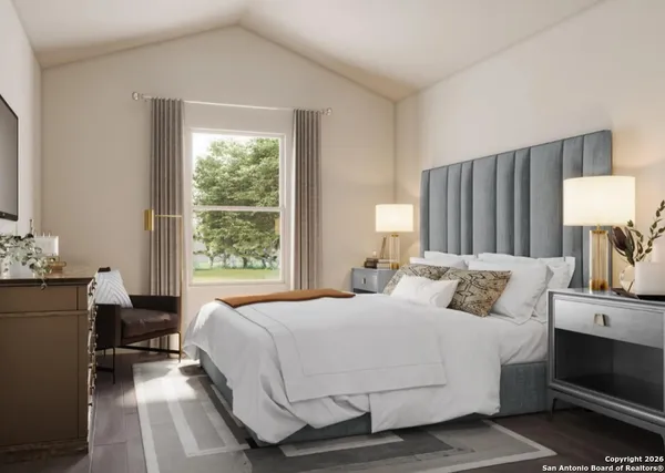 a kitchen with stainless steel appliances granite countertop a stove a refrigerator a sink a dining table and chairs with wooden floor