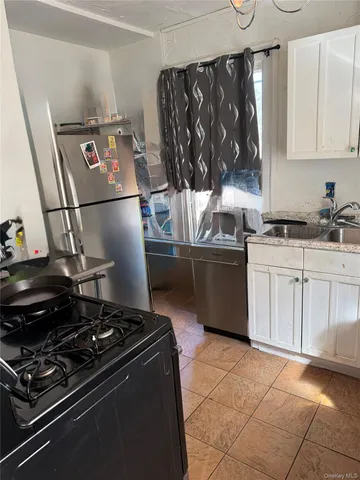 a kitchen with a stove and a refrigerator