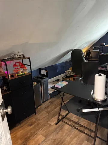 a view of a workspace with furniture