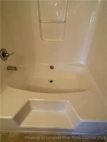 a bathroom with a bath tub