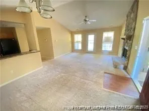 a view of a hallway with a chandelier