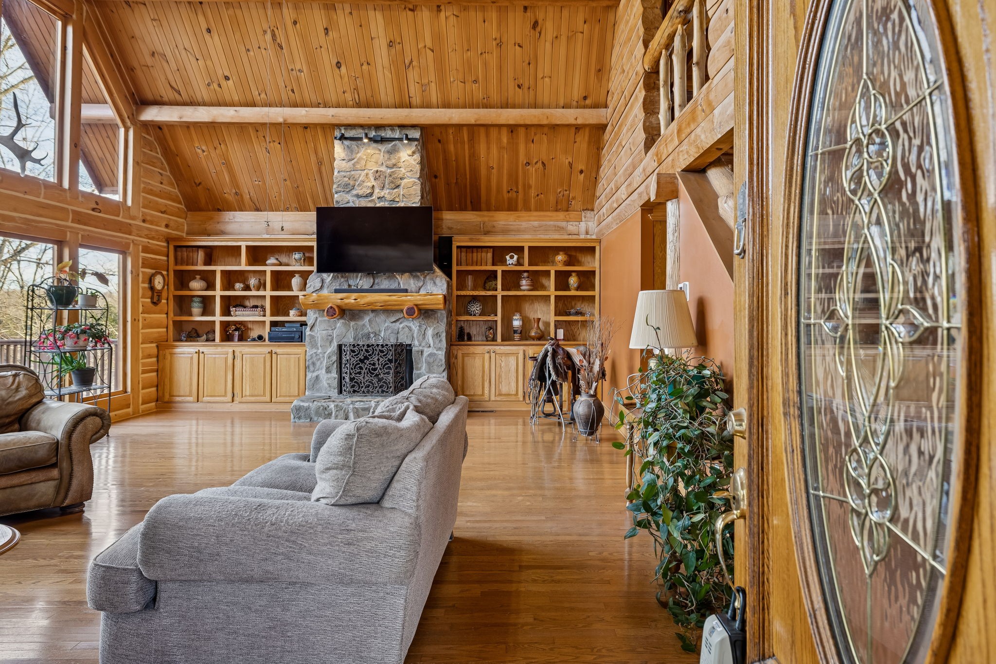 20151 Ben Fly Road Lyles, TN 37098 - Photo 11 of 98 a living room with furniture a flat screen tv and a fireplace