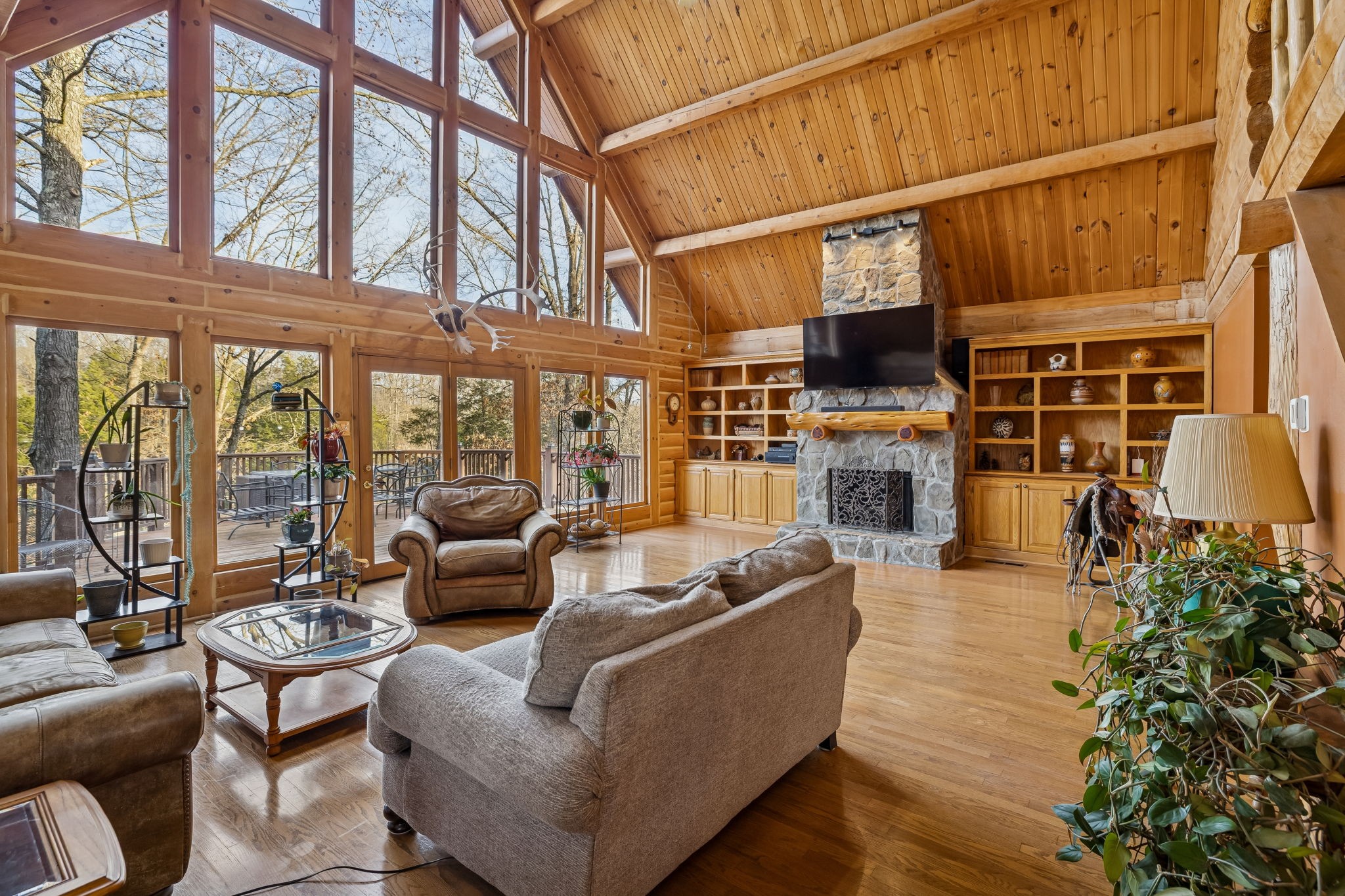 20151 Ben Fly Road Lyles, TN 37098 - Photo 14 of 98 a living room with furniture a fireplace a flat screen tv and windows