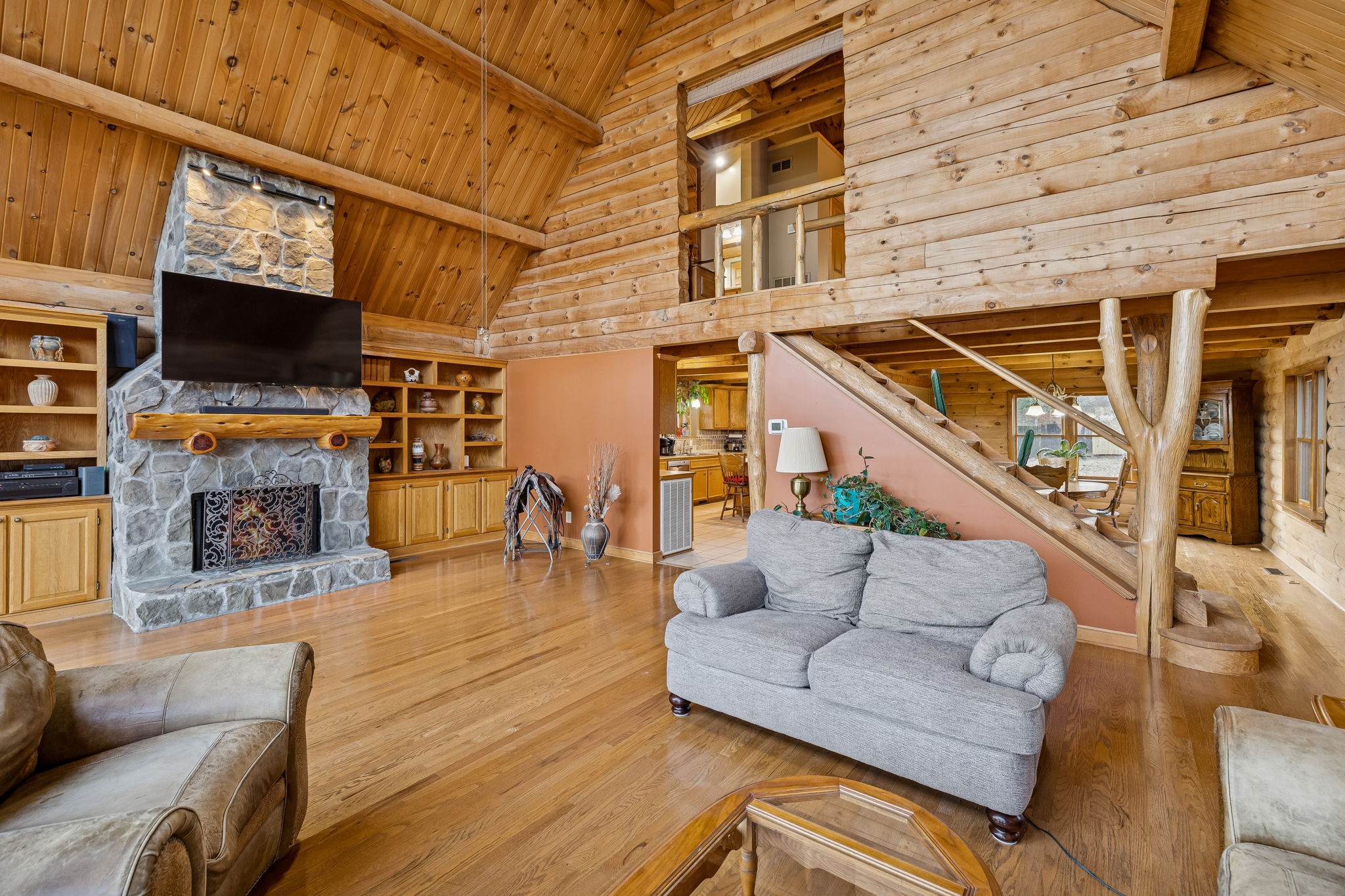 20151 Ben Fly Road Lyles, TN 37098 - Photo 17 of 98 a living room with furniture a flat screen tv and a fireplace