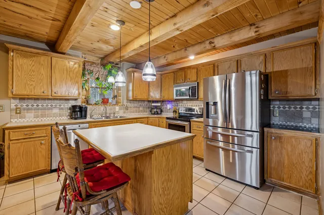 a view of a deck with table and chairs and wooden floor