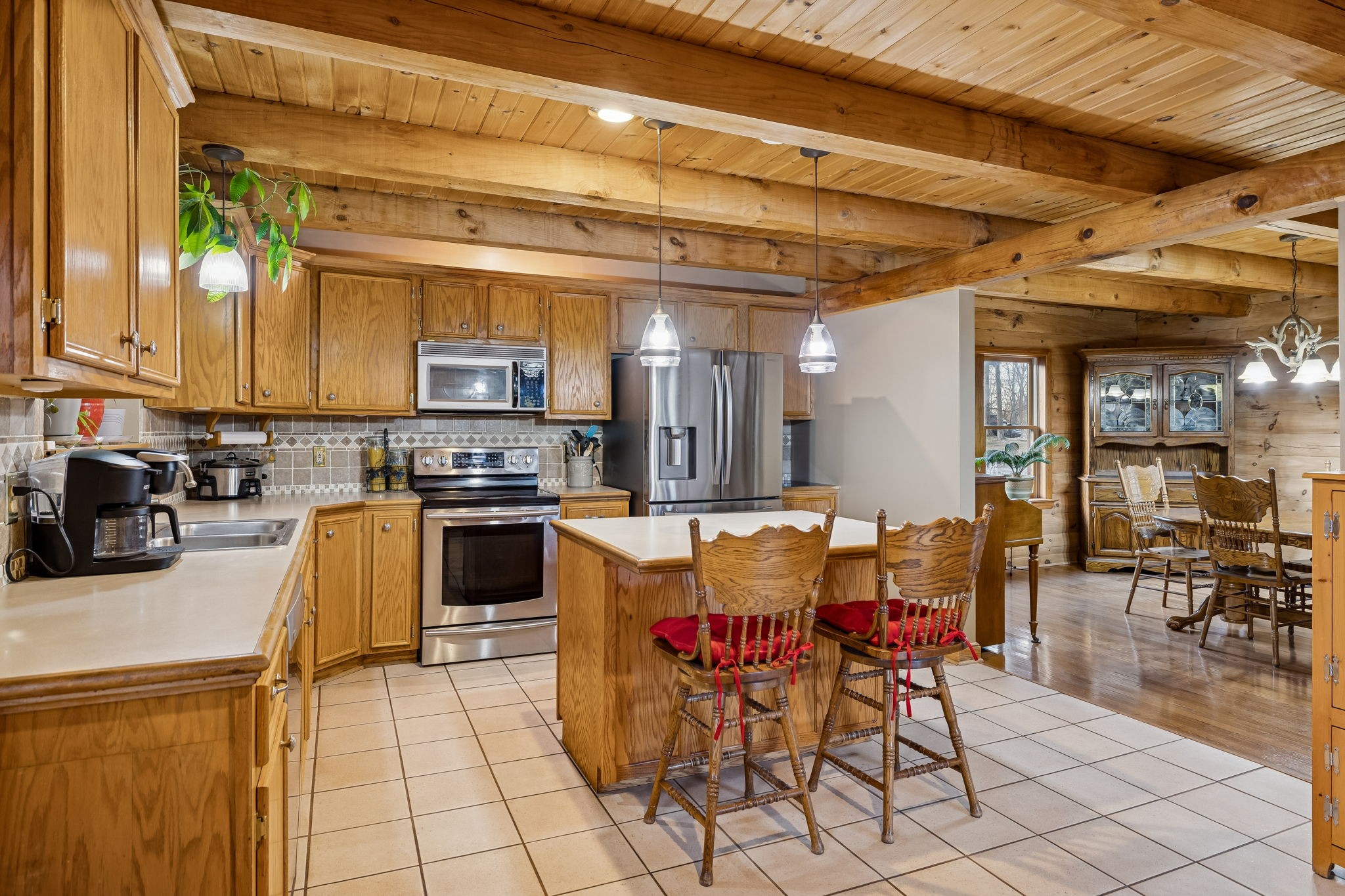 20151 Ben Fly Road Lyles, TN 37098 - Photo 33 of 98 a kitchen with a table chairs stove and cabinets