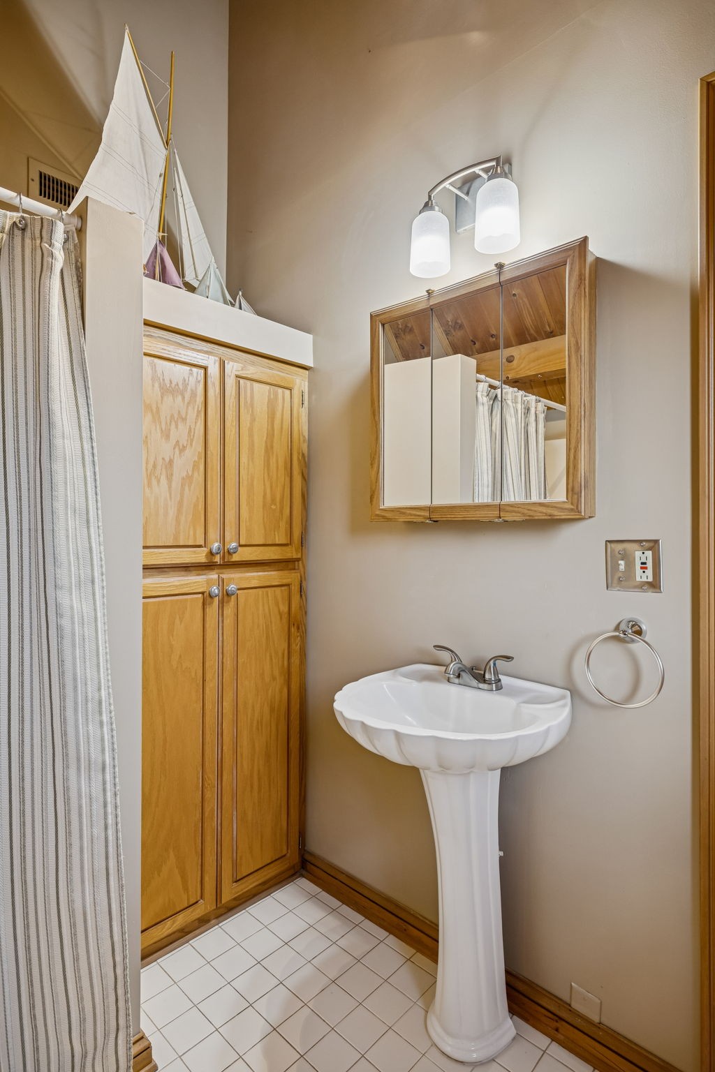 20151 Ben Fly Road Lyles, TN 37098 - Photo 47 of 98 a bathroom with a sink a mirror and shower
